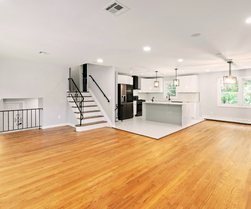 Modern open-concept kitchen and living area renovation by NOCO Remodeling & Design in Loveland.